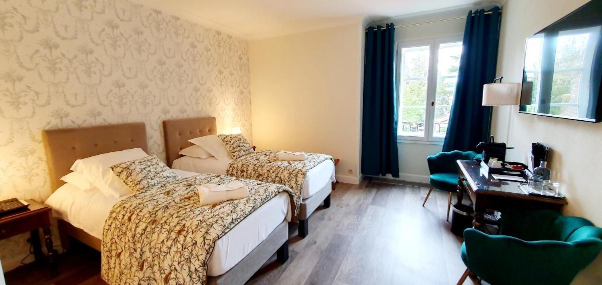 Un ou plusieurs lits dans un hébergement de l'établissement Demeures & Châteaux - Hôtel Greuze & Spa Tournus