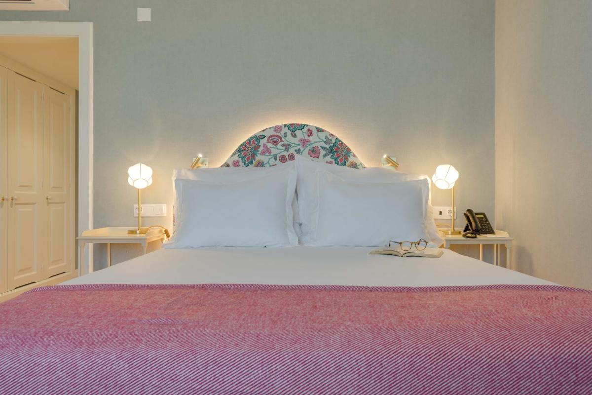 Uma cama ou camas num quarto em Pestana Quinta Perestrello