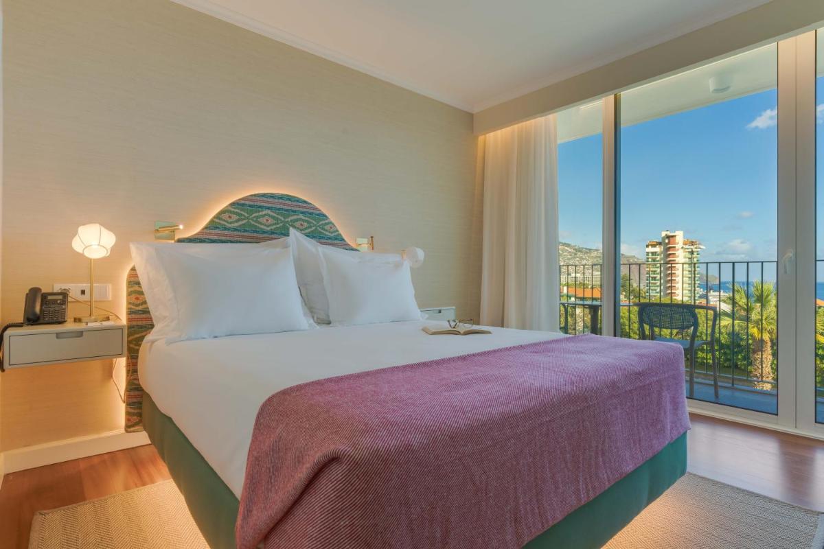 Uma cama ou camas num quarto em Pestana Quinta Perestrello