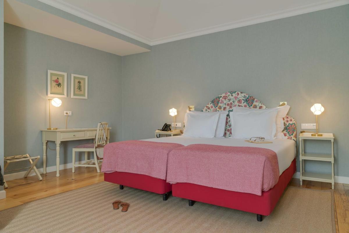 Uma cama ou camas num quarto em Pestana Quinta Perestrello