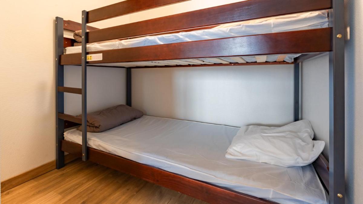 Un ou plusieurs lits dans un hébergement de l'établissement Vacancéole - Appart'Vacances Pyrénées 2000