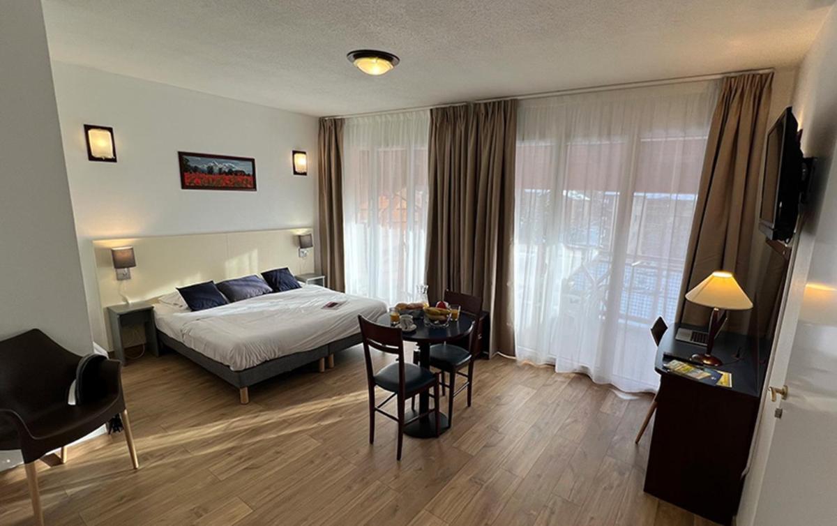 Un ou plusieurs lits dans un hébergement de l'établissement Vacancéole - Appart'Vacances Pyrénées 2000