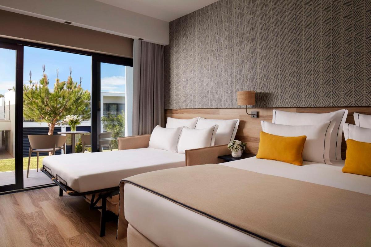 Uma cama ou camas num quarto em Tivoli Alvor Algarve - All Inclusive Resort