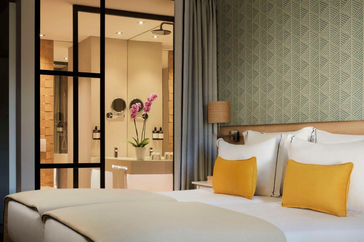 Uma cama ou camas num quarto em Tivoli Alvor Algarve - All Inclusive Resort