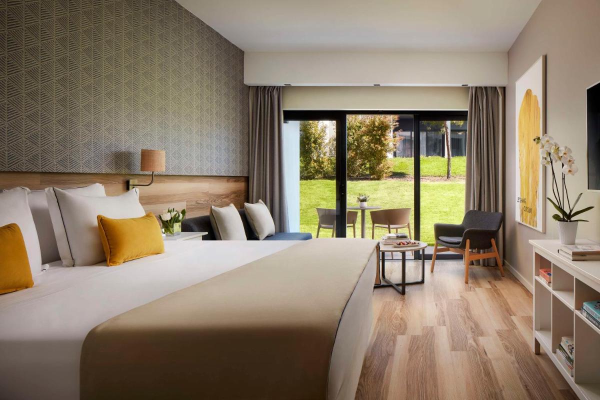 Uma cama ou camas num quarto em Tivoli Alvor Algarve - All Inclusive Resort
