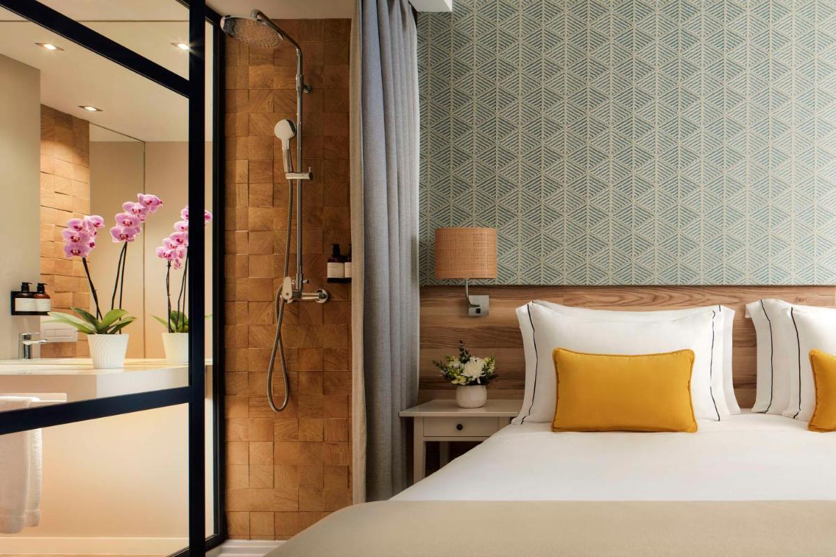 Uma cama ou camas num quarto em Tivoli Alvor Algarve - All Inclusive Resort