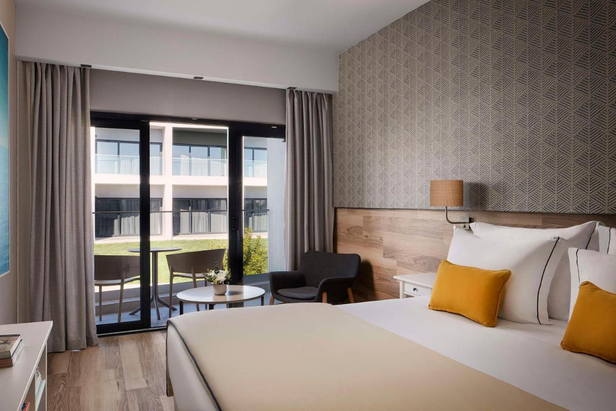 Uma cama ou camas num quarto em Tivoli Alvor Algarve - All Inclusive Resort