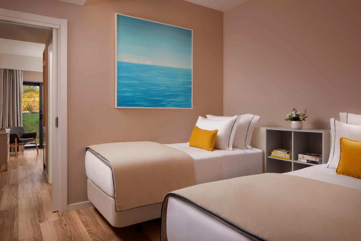 Uma cama ou camas num quarto em Tivoli Alvor Algarve - All Inclusive Resort