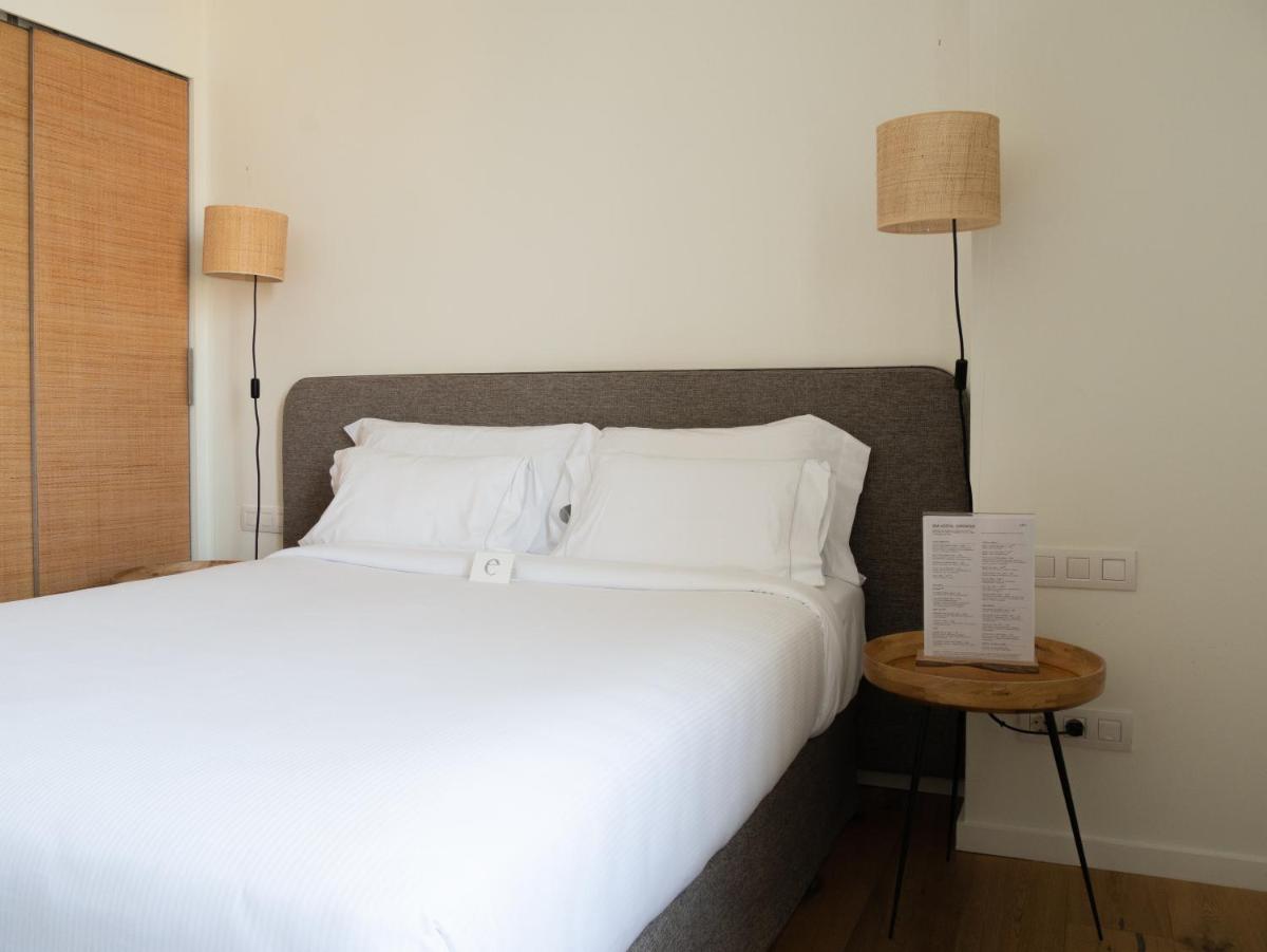 Cama o camas de una habitación en Hostal Empúries