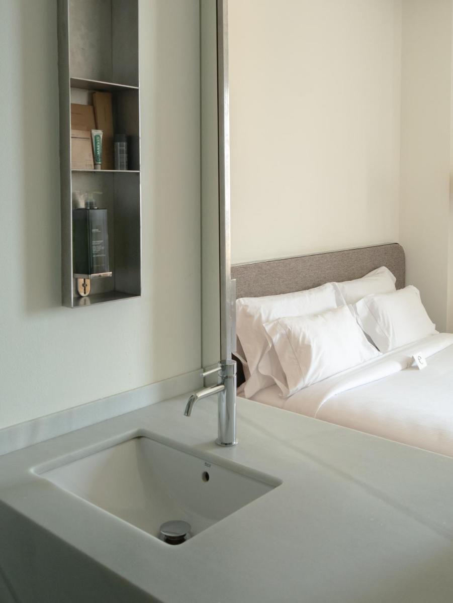 Cama o camas de una habitación en Hostal Empúries