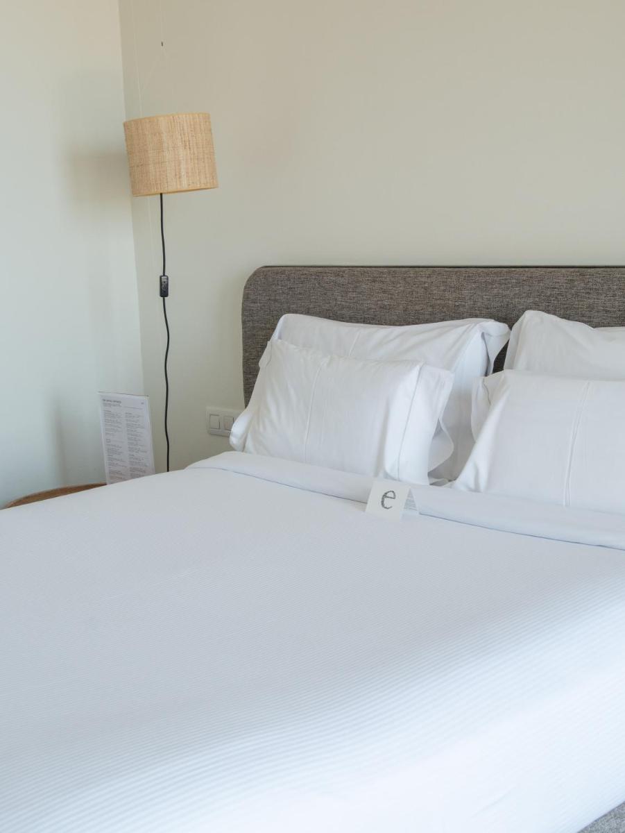 Cama o camas de una habitación en Hostal Empúries