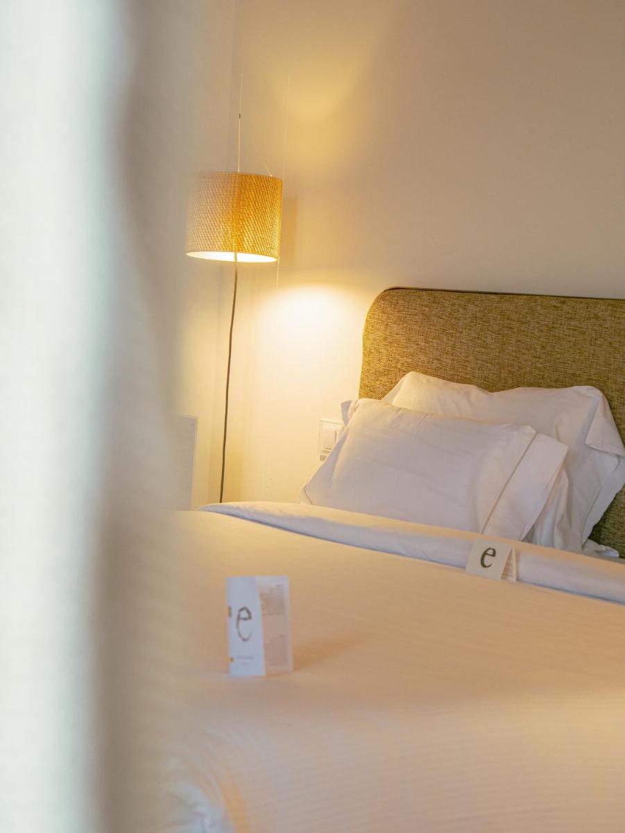 Cama o camas de una habitación en Hostal Empúries