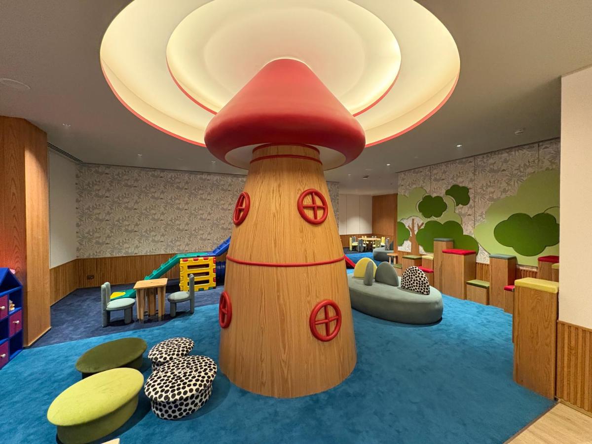 a childrens play area with a mushroom house at Taj Agra in Agra
