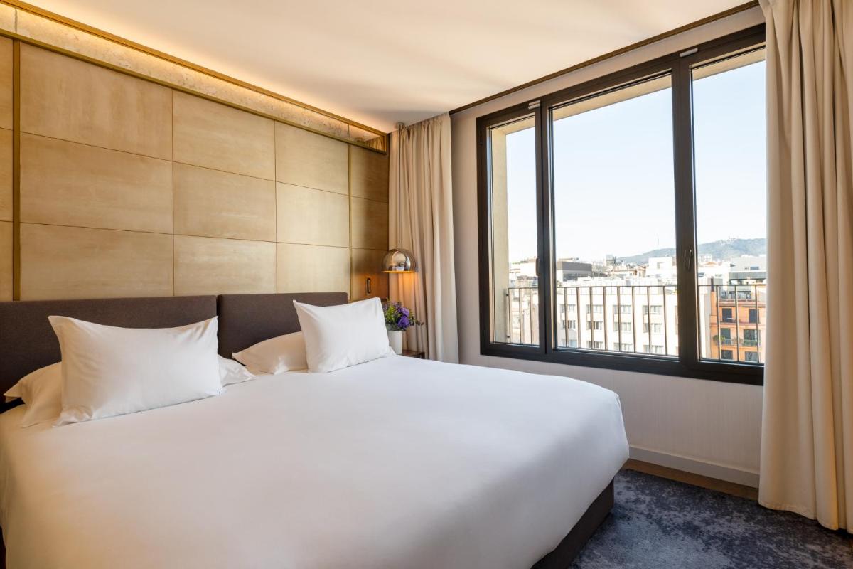 Cama o camas de una habitación en Almanac Barcelona