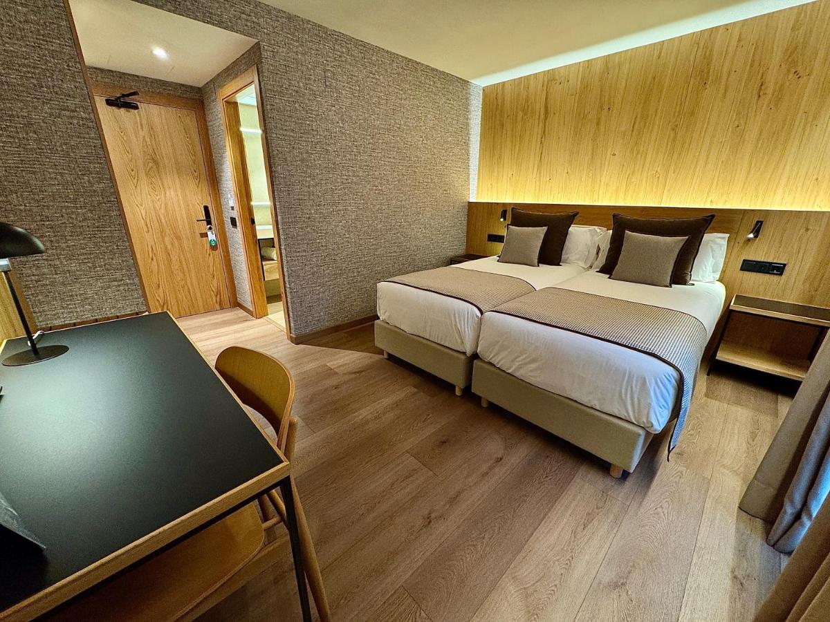 Cama o camas de una habitación en Hotel Petit Lacreu