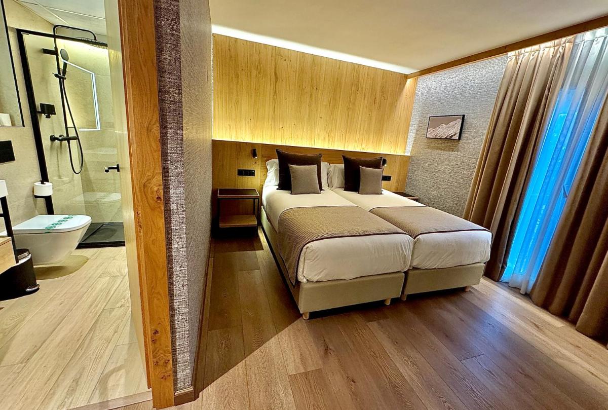 Cama o camas de una habitación en Hotel Petit Lacreu