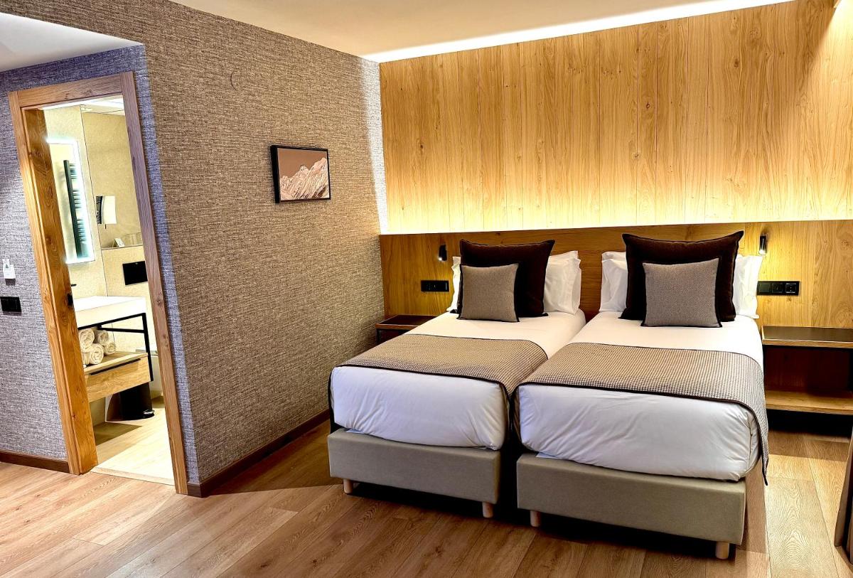 Cama o camas de una habitación en Hotel Petit Lacreu