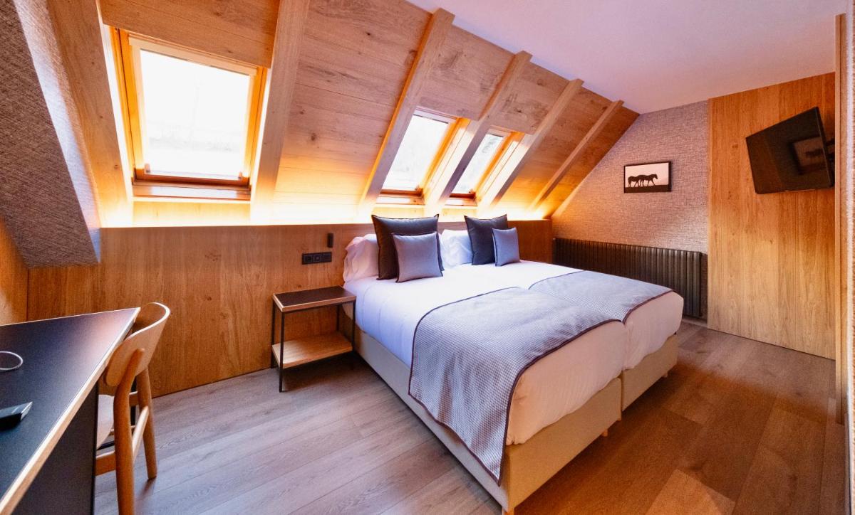 Cama o camas de una habitación en Hotel Petit Lacreu
