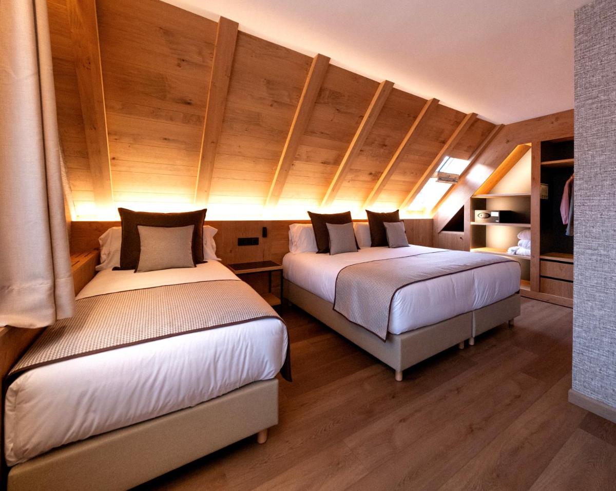 Cama o camas de una habitación en Hotel Petit Lacreu