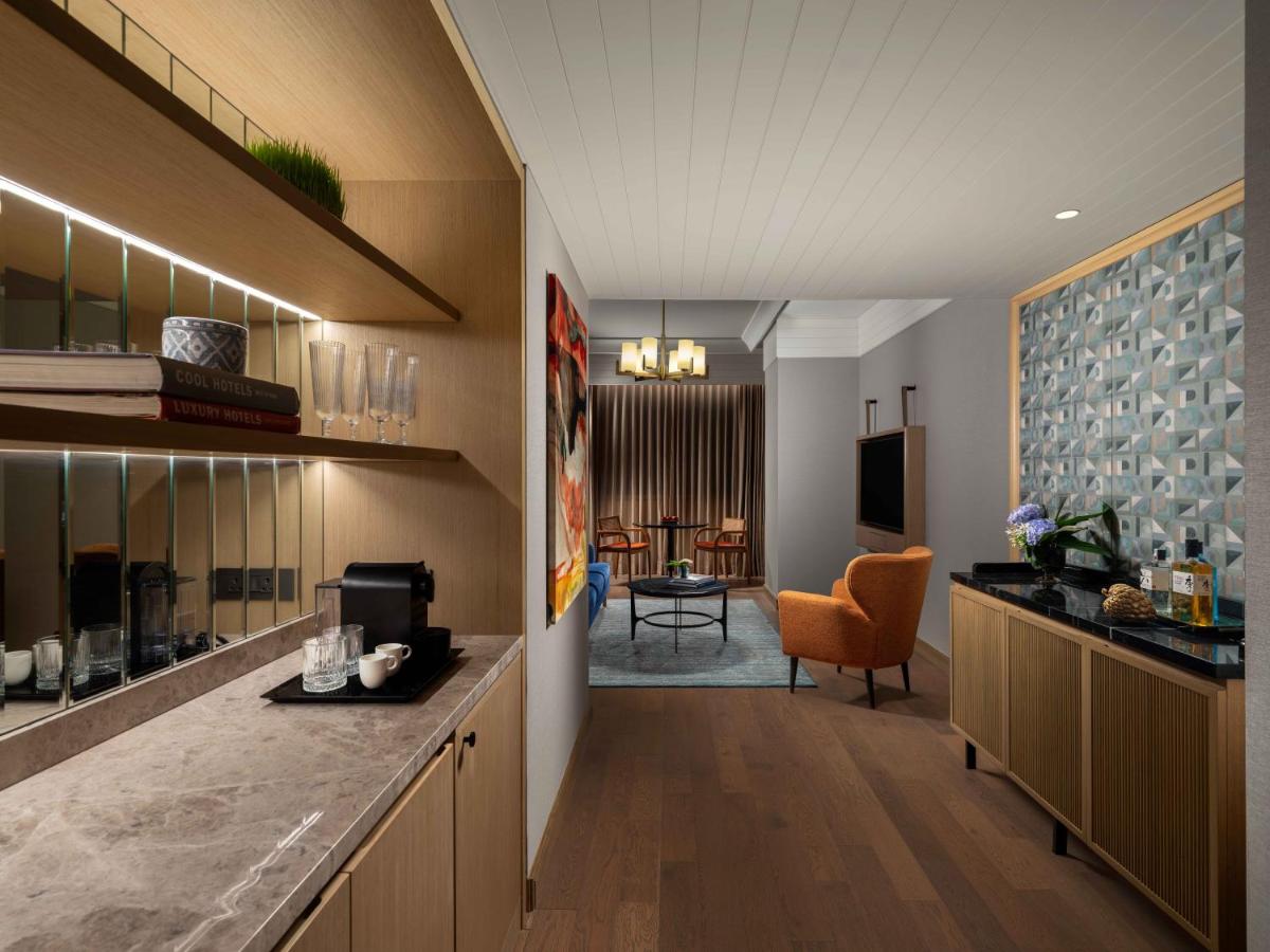 a hotel room with a kitchen and a living room at Pullman Chennai Anna Salai - Premium Brand By Accor in Chennai
