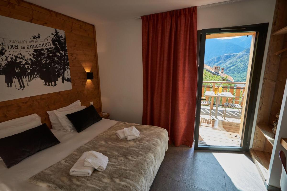 Un ou plusieurs lits dans un hébergement de l'établissement Pure Montagne Resort & Spa