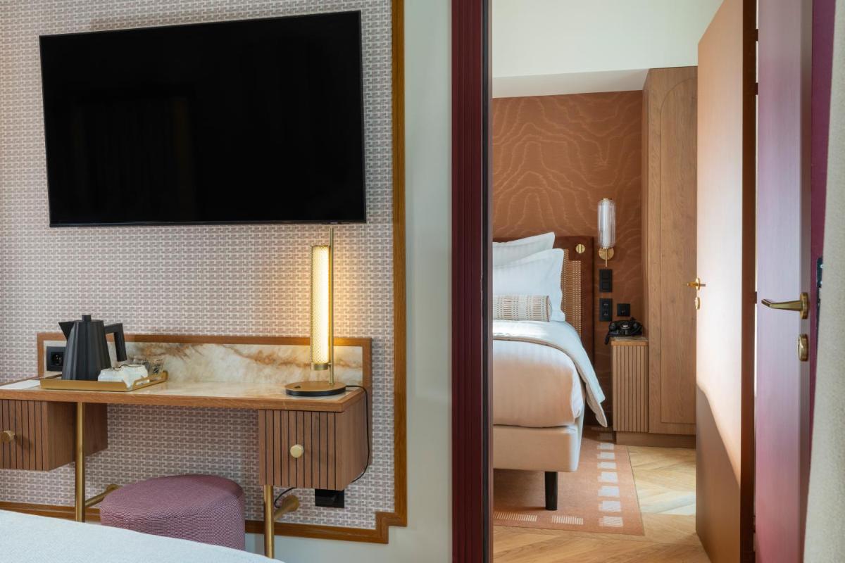 Un ou plusieurs lits dans un hébergement de l'établissement Hôtel Filigrane & Spa