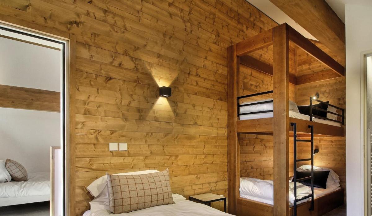 Un ou plusieurs lits dans un hébergement de l'établissement Pure Montagne Resort & Spa