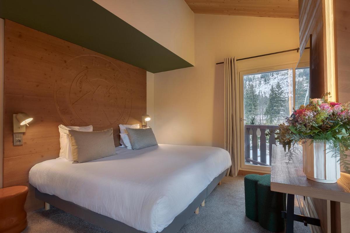 Un ou plusieurs lits dans un hébergement de l'établissement Lykke Hôtel & Spa Chamonix - ex Mercure