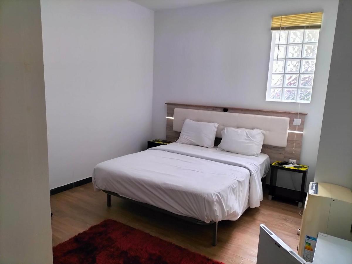 Uma cama ou camas num quarto em TarmarPlace
