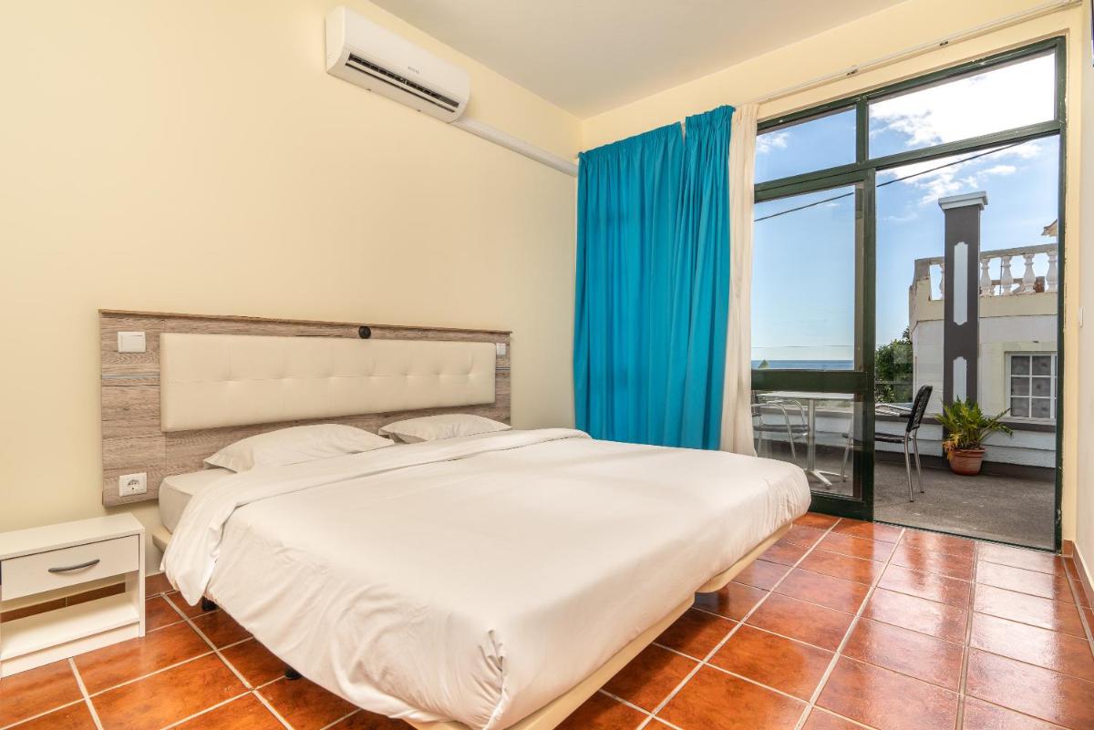 Uma cama ou camas num quarto em TarmarPlace