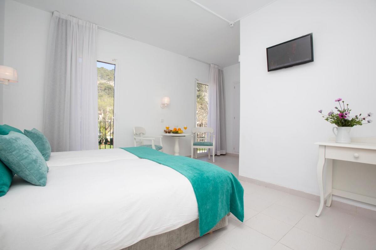 Cama o camas de una habitación en Hotel Marina