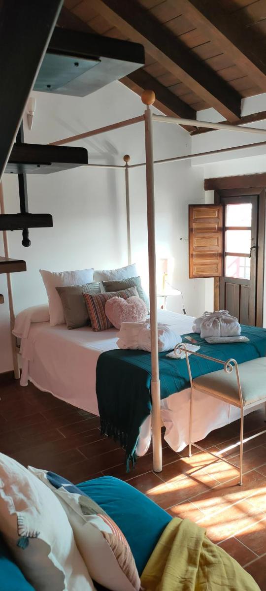 Cama o camas de una habitación en Hotel La Casa del Canónigo
