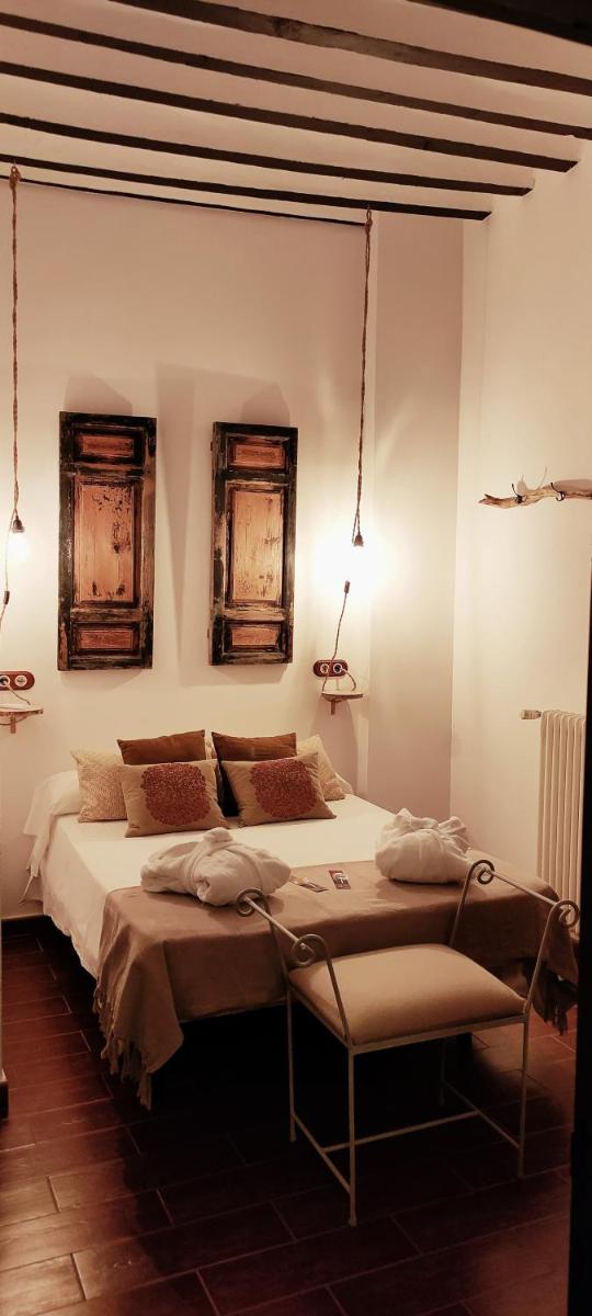 Cama o camas de una habitación en Hotel La Casa del Canónigo