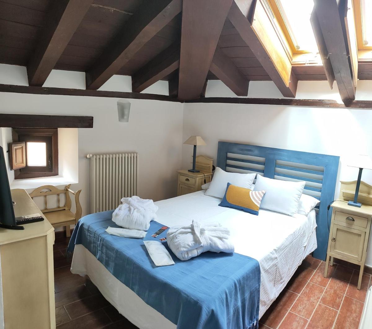Cama o camas de una habitación en Hotel La Casa del Canónigo
