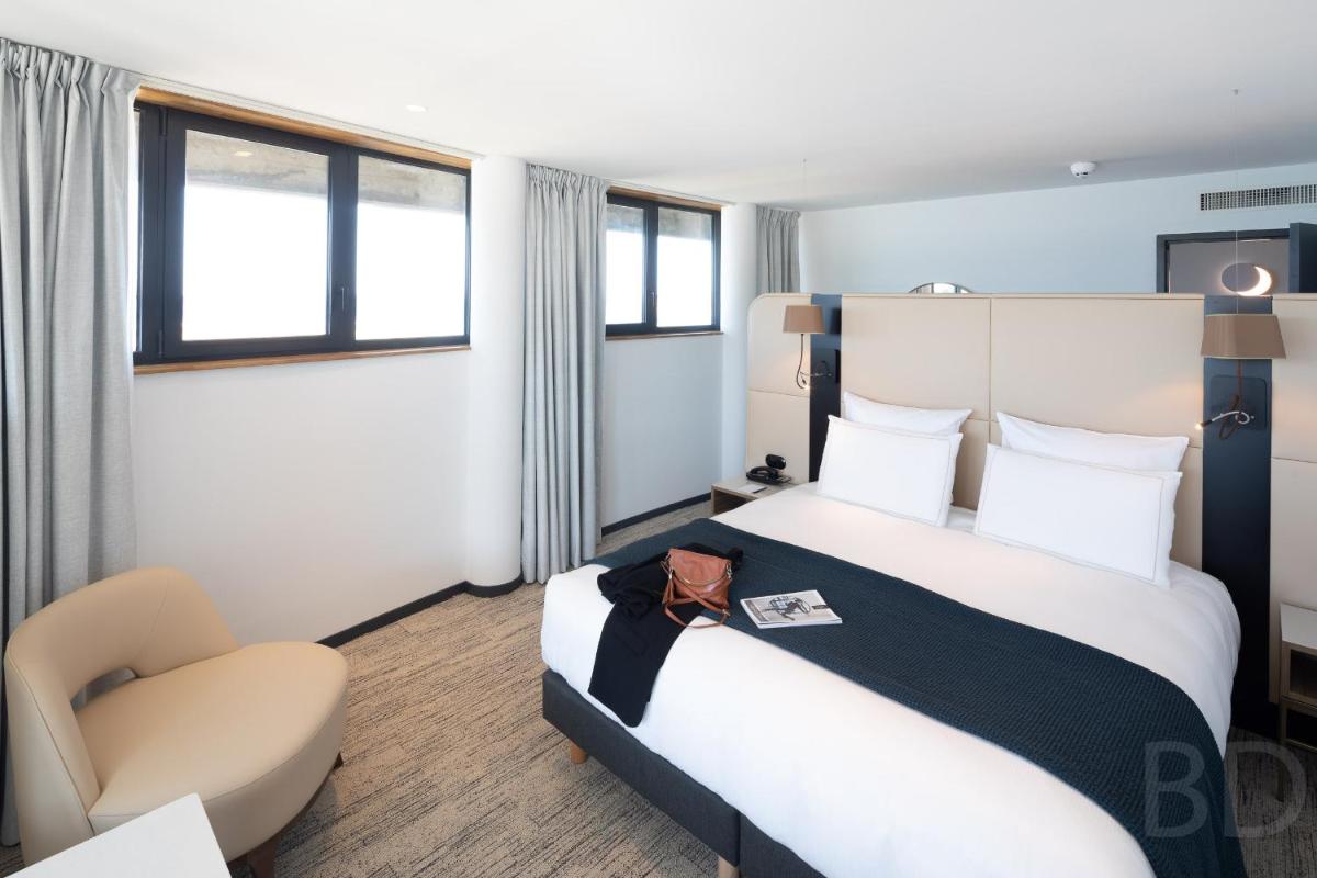Un ou plusieurs lits dans un hébergement de l'établissement Sainte-Barbe Hotel & Spa Le Conquet - MGallery Collection
