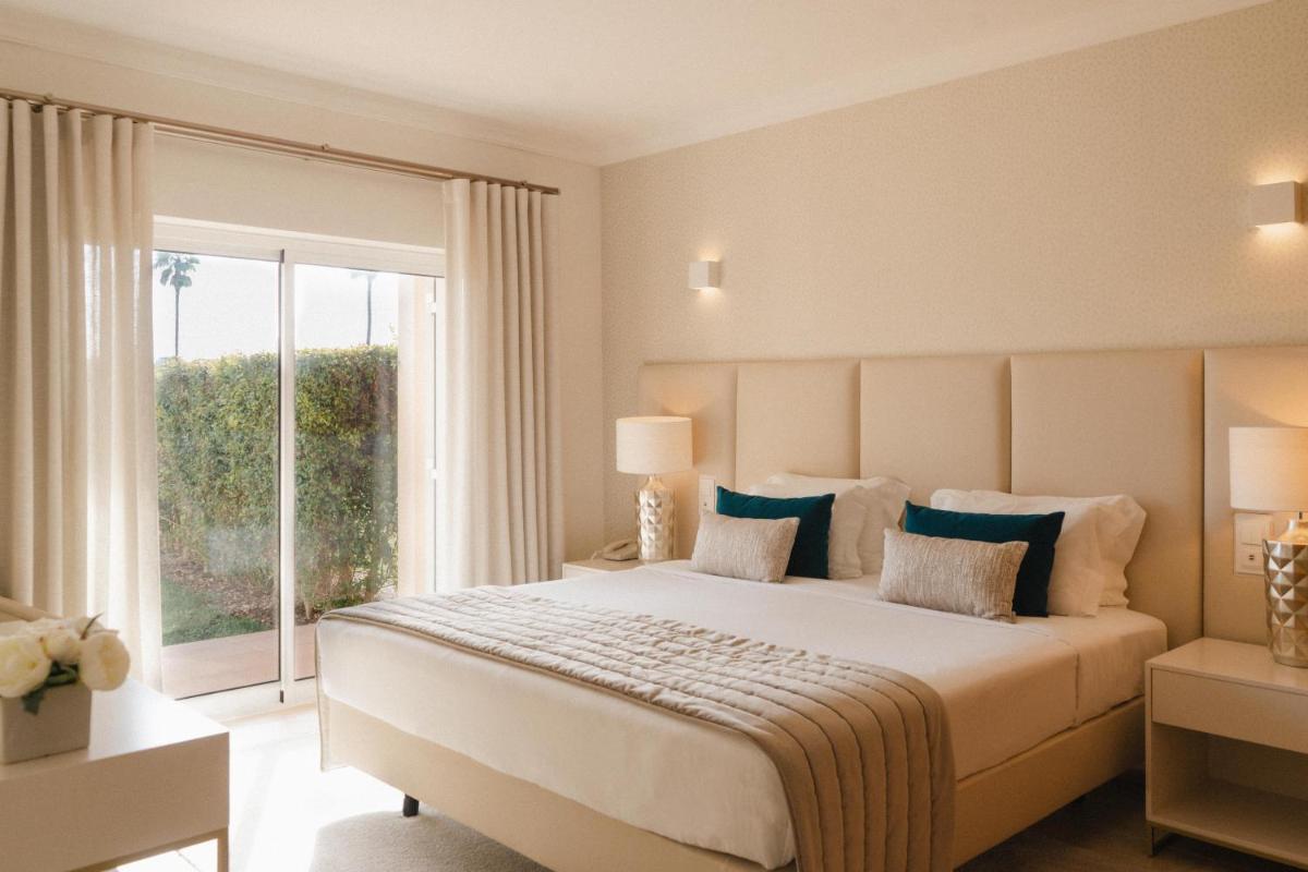 Uma cama ou camas num quarto em Vale d'Oliveiras Quinta Resort & Spa
