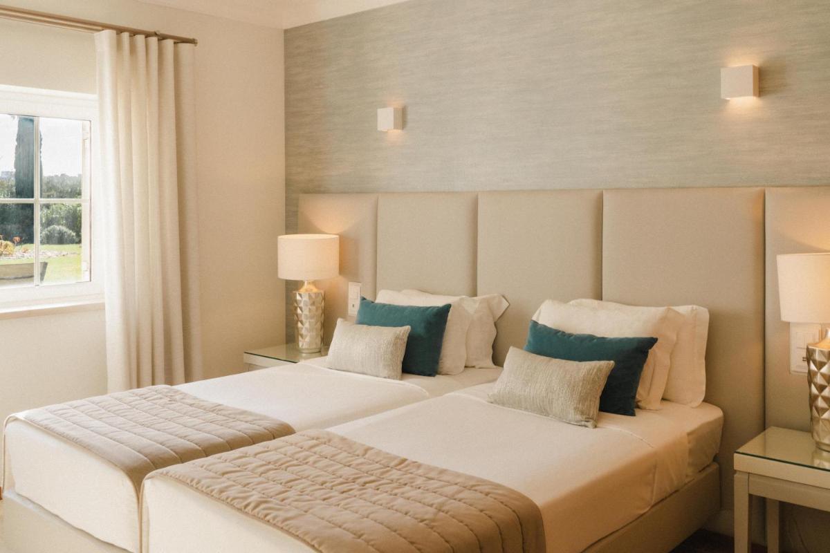 Uma cama ou camas num quarto em Vale d'Oliveiras Quinta Resort & Spa