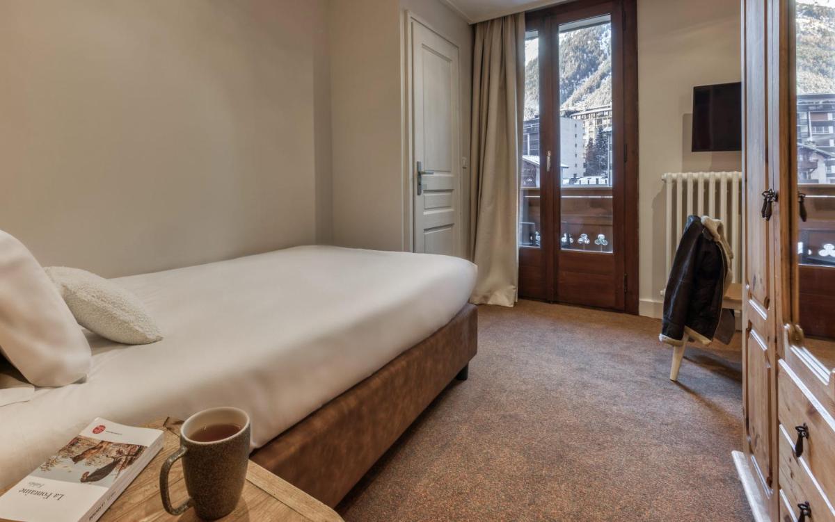 Un ou plusieurs lits dans un hébergement de l'établissement Hôtel Lyret