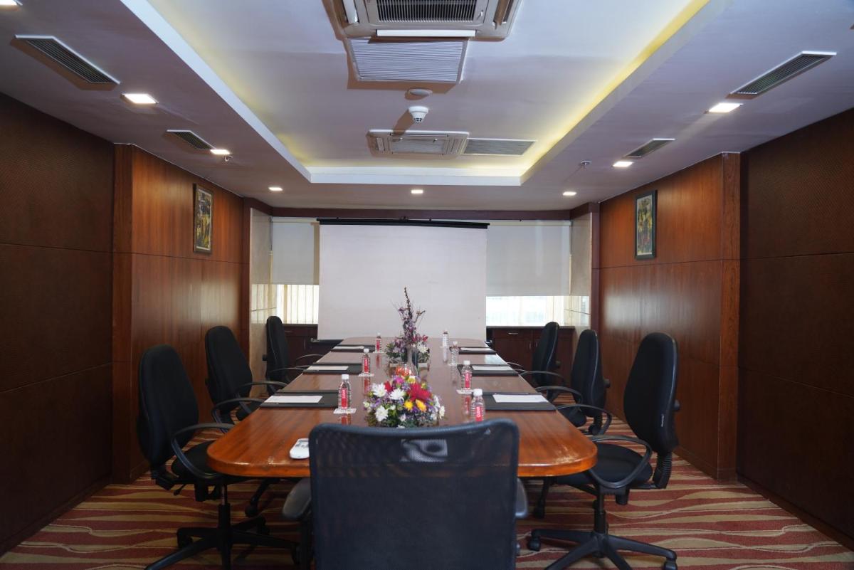 a conference room with a long table and chairs at Fortune Select JP Cosmos, Bengaluru - Member ITC Hotels' Group in Bengaluru