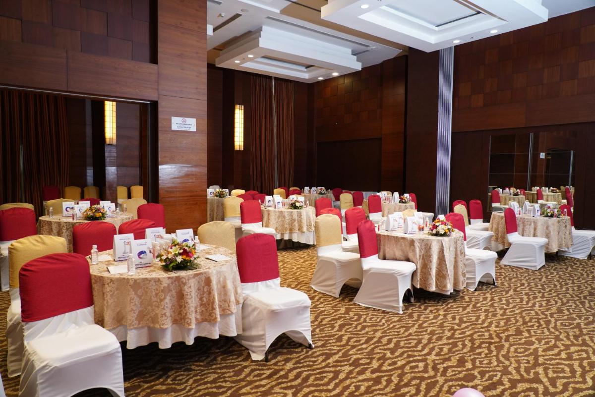 a banquet room with tables and chairs and tablesktop at Fortune Select JP Cosmos, Bengaluru - Member ITC Hotels' Group in Bengaluru