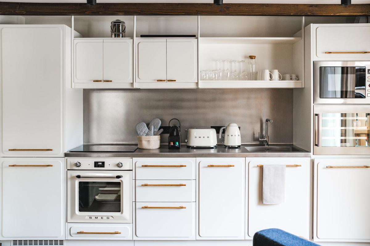 Cuisine ou kitchenette dans l'établissement Appartements de l'Héliopic