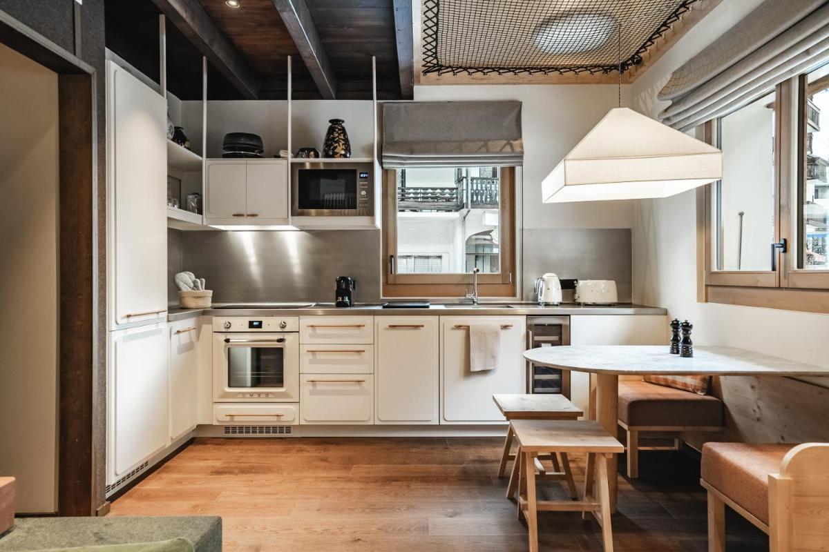 Cuisine ou kitchenette dans l'établissement Appartements de l'Héliopic