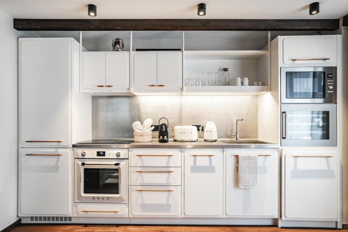 Cuisine ou kitchenette dans l'établissement Appartements de l'Héliopic