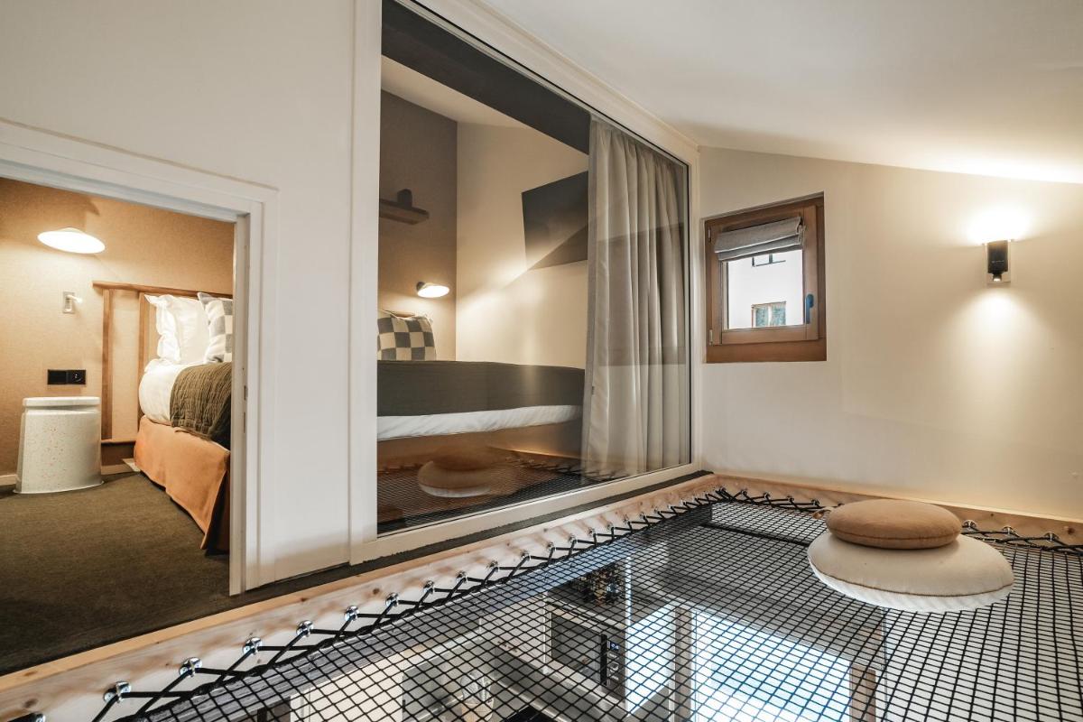 Un ou plusieurs lits dans un hébergement de l'établissement Appartements de l'Héliopic