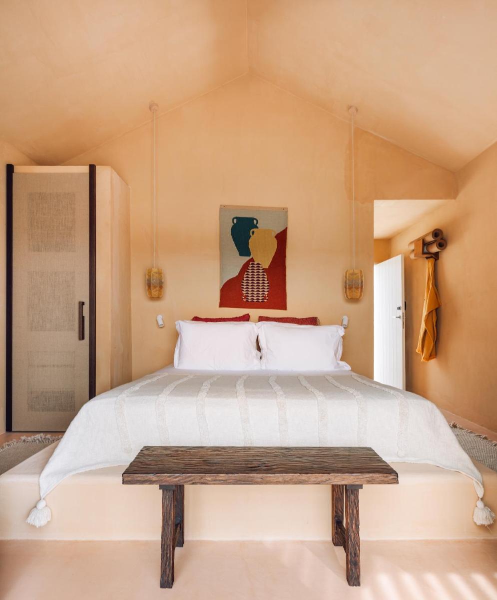 Uma cama ou camas num quarto em Independente Comporta