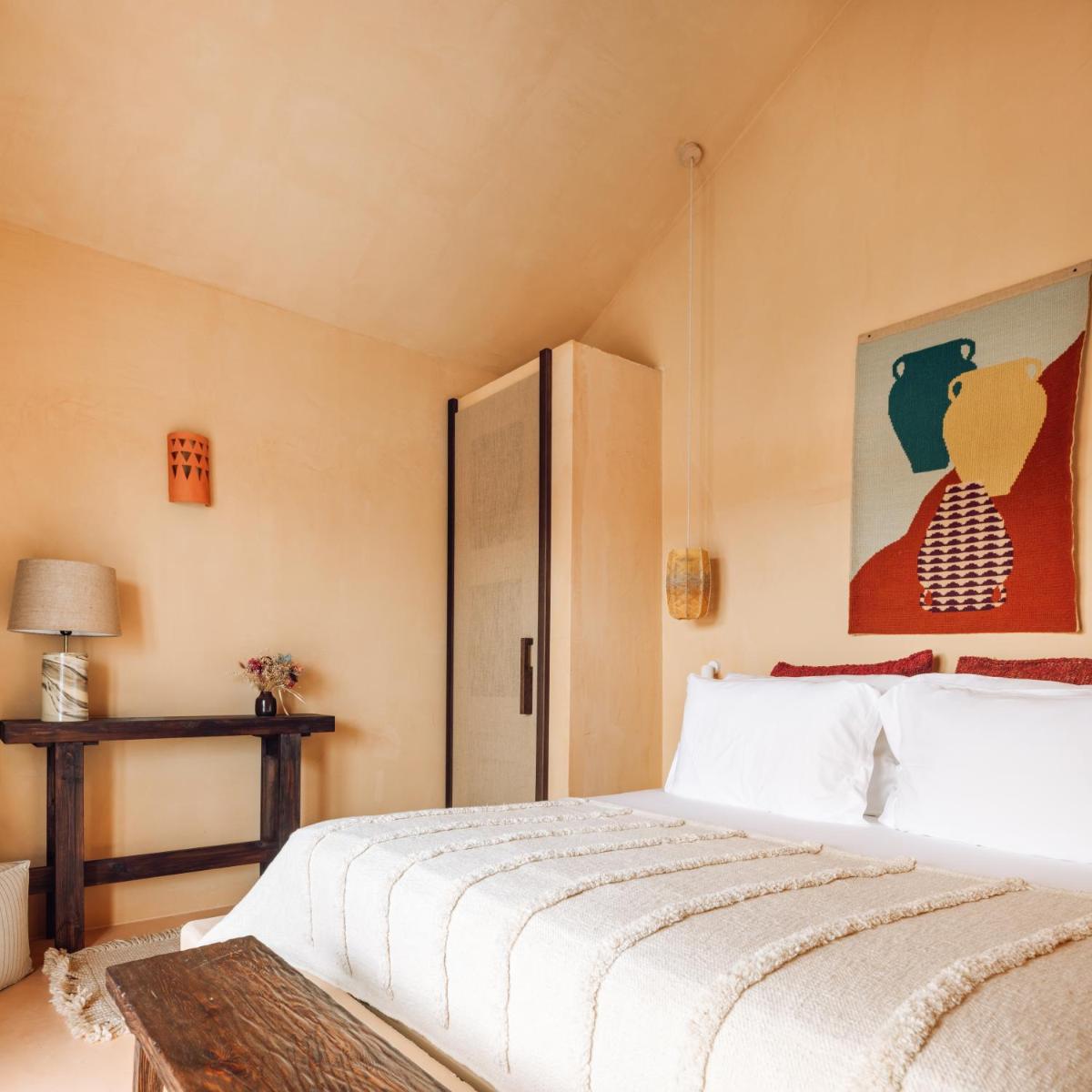 Uma cama ou camas num quarto em Independente Comporta