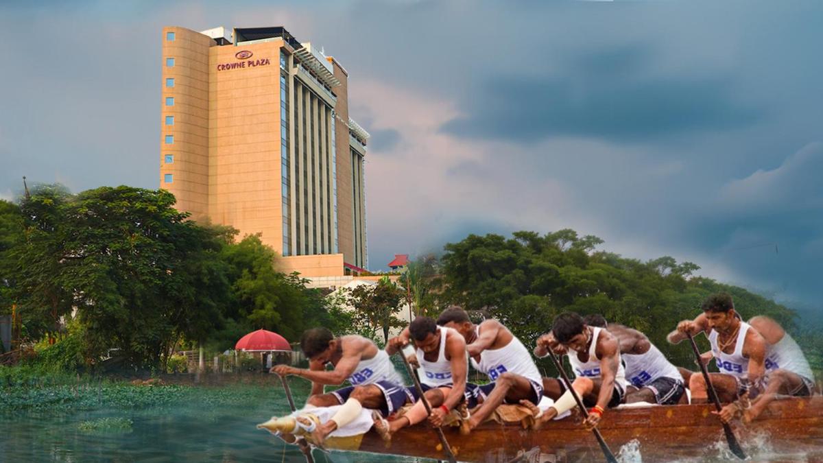a group of people in a boat in the water at Crowne Plaza Kochi by IHG in Cochin