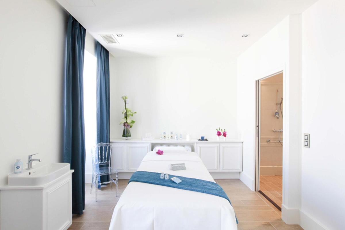 Un ou plusieurs lits dans un hébergement de l'établissement La Cour des Consuls Hotel & Spa Toulouse - MGallery Collection