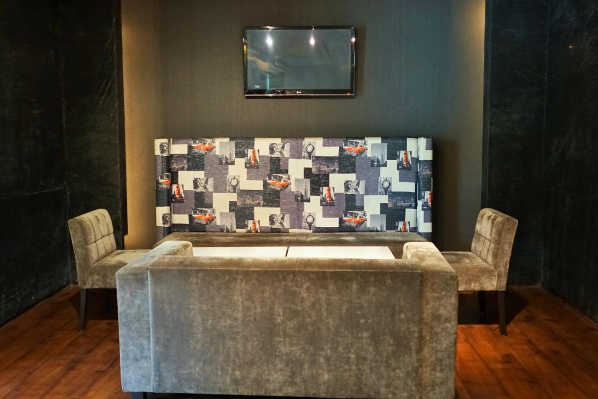 a waiting room with a table and two chairs at Taj Chandigarh in Chandīgarh
