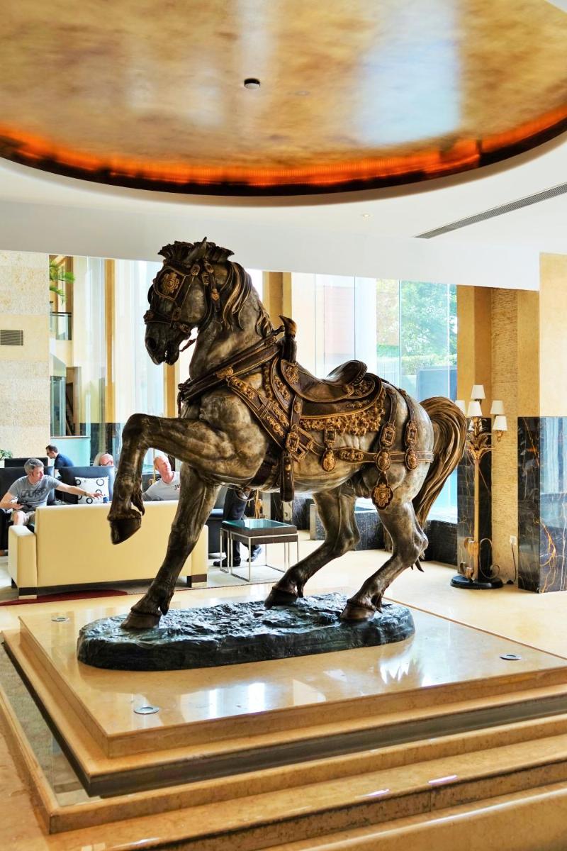 a statue of a horse on display in a museum at Taj Chandigarh in Chandīgarh